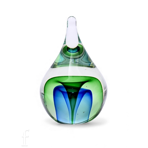297 - A contemporary glass paperweight or tear drop form, with central air bubble within blue and green tr... 