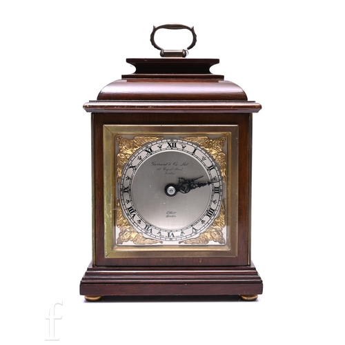 704 - A post 1950s mahogany cased bracket clock by Elliott London, retailed by Garrard & Co Ltd, fixed... 