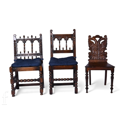 814 - A pair of 17th Century style oak standard chairs on bobbin turned legs and an oak hall chair with ca... 