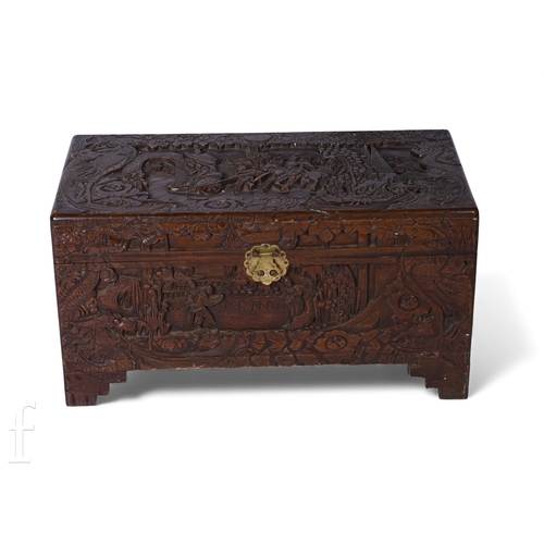 821 - A small 20th Century carved camphorwood coffer the lid carved with a royal procession, over conformi... 