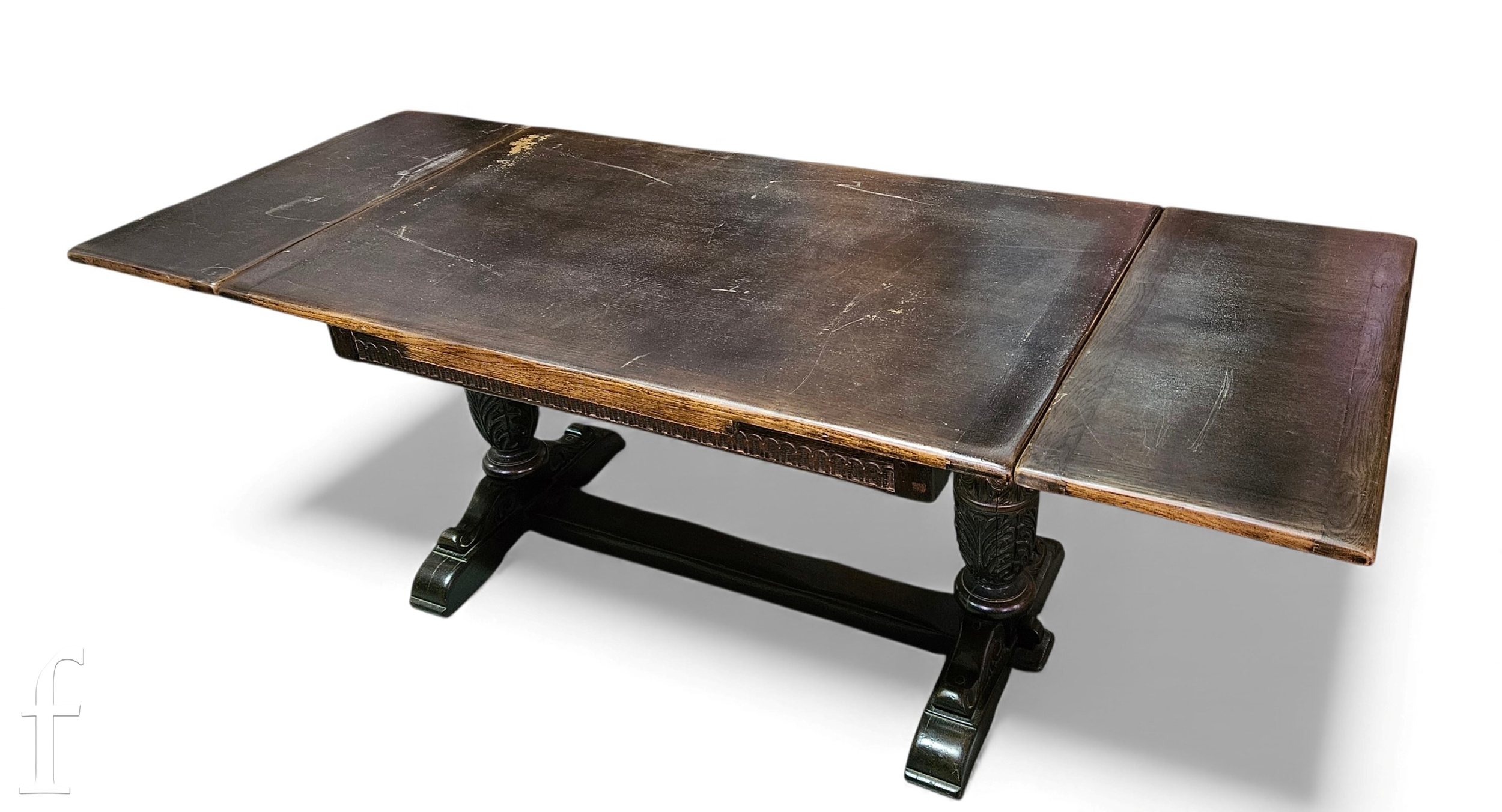 A 17th Century style oak refectory draw leaf dining table on twin leaf ...