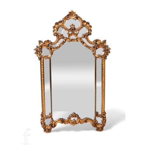 833 - A reproduction pier mirror with acanthus scroll gilt frame, height 131cm and width 80cm.