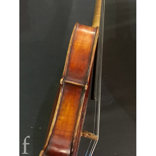 468 - A late 19th Century violin labelled Joseph Guarnerius filius Andrea fecit, length 36cm in plush line... 