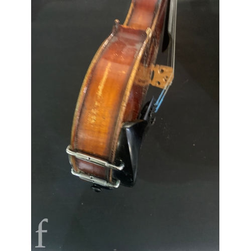 468 - A late 19th Century violin labelled Joseph Guarnerius filius Andrea fecit, length 36cm in plush line... 