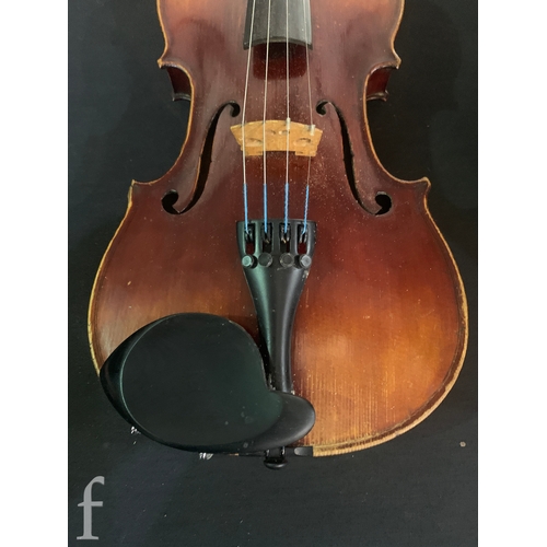468 - A late 19th Century violin labelled Joseph Guarnerius filius Andrea fecit, length 36cm in plush line... 
