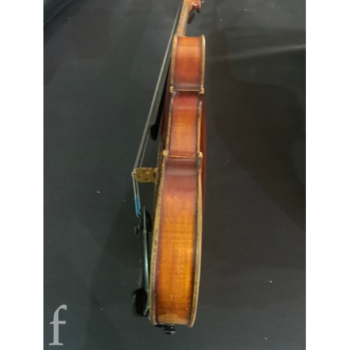 468 - A late 19th Century violin labelled Joseph Guarnerius filius Andrea fecit, length 36cm in plush line... 