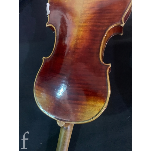 470 - A late 19th Century German violin labelled Antonius Stradivarius, two piece back with bow, length 35... 