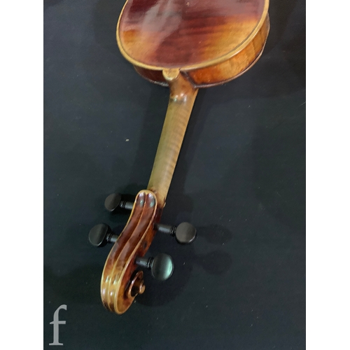 470 - A late 19th Century German violin labelled Antonius Stradivarius, two piece back with bow, length 35... 