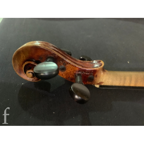 470 - A late 19th Century German violin labelled Antonius Stradivarius, two piece back with bow, length 35... 