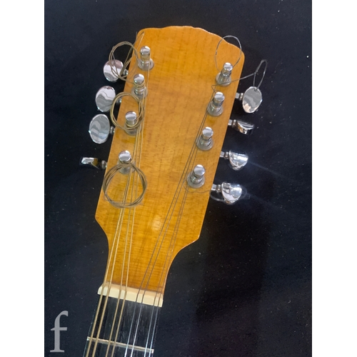 471 - A 20th Century Mandolin by Dunn, in fitted plush lined case, length 66cm.