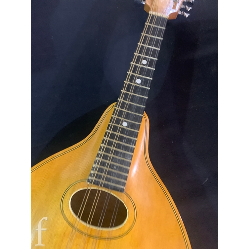 471 - A 20th Century Mandolin by Dunn, in fitted plush lined case, length 66cm.