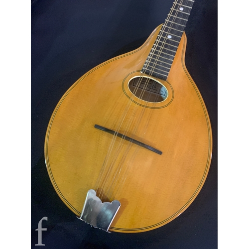 471 - A 20th Century Mandolin by Dunn, in fitted plush lined case, length 66cm.