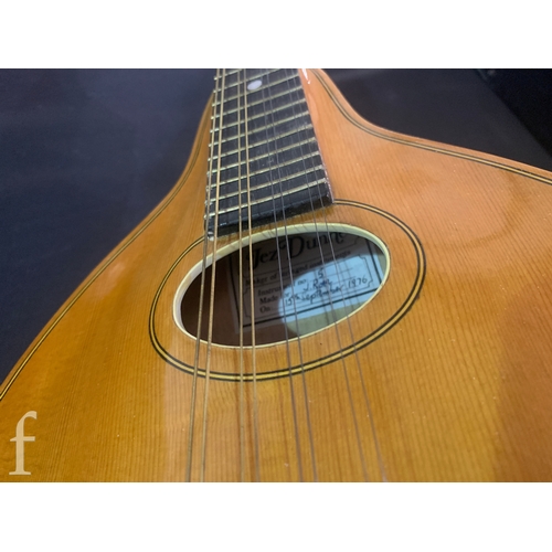 471 - A 20th Century Mandolin by Dunn, in fitted plush lined case, length 66cm.