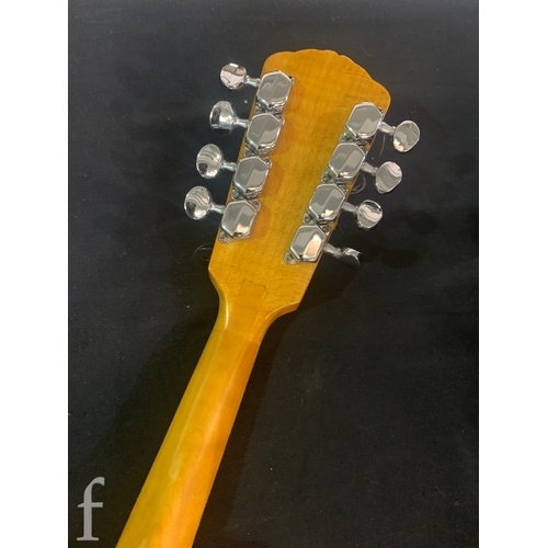 471 - A 20th Century Mandolin by Dunn, in fitted plush lined case, length 66cm.