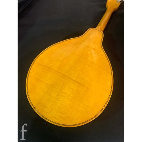 471 - A 20th Century Mandolin by Dunn, in fitted plush lined case, length 66cm.