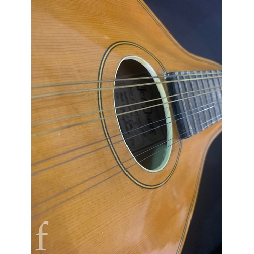 471 - A 20th Century Mandolin by Dunn, in fitted plush lined case, length 66cm.