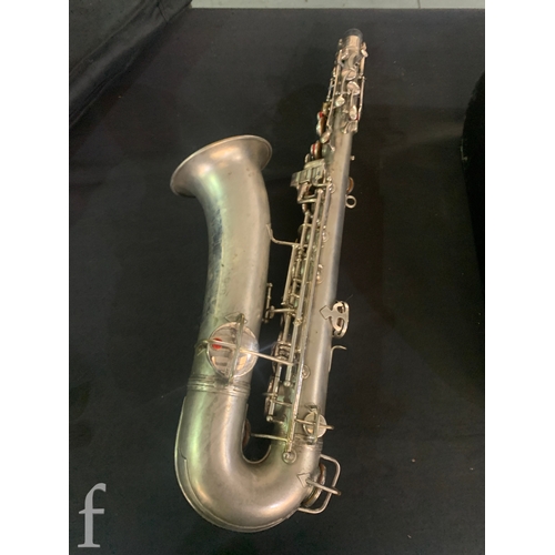 472 - A 20th Century or earlier nickel plated saxophone No 111892, length 62cm, in fitted plush lined case... 