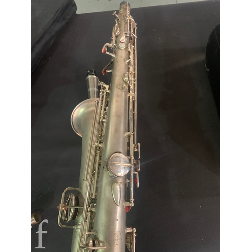 472 - A 20th Century or earlier nickel plated saxophone No 111892, length 62cm, in fitted plush lined case... 