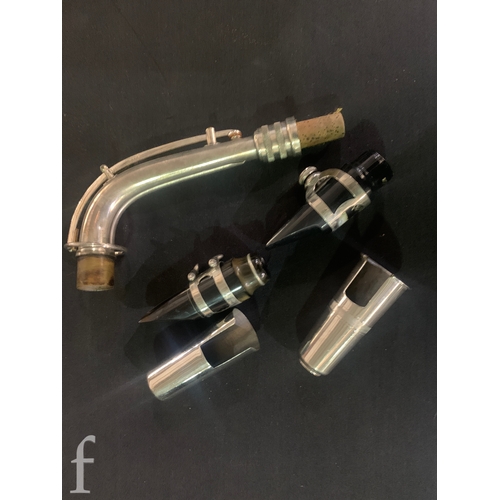 472 - A 20th Century or earlier nickel plated saxophone No 111892, length 62cm, in fitted plush lined case... 