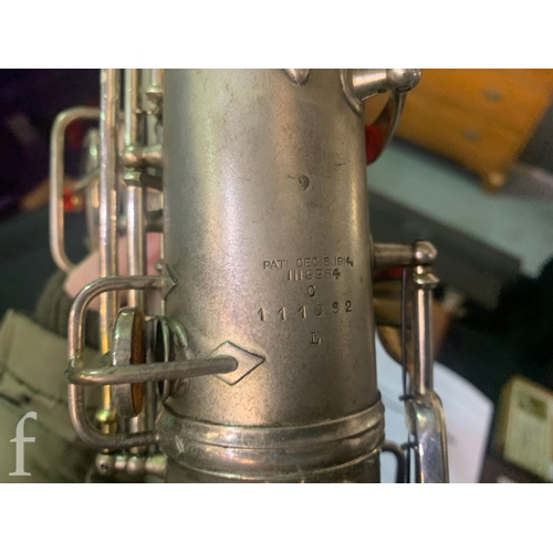 472 - A 20th Century or earlier nickel plated saxophone No 111892, length 62cm, in fitted plush lined case... 