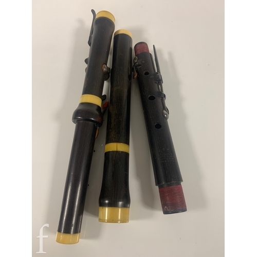 476 - A 19th Century Rudall Rose Carte & Co three sectional flute, in mahogany case.