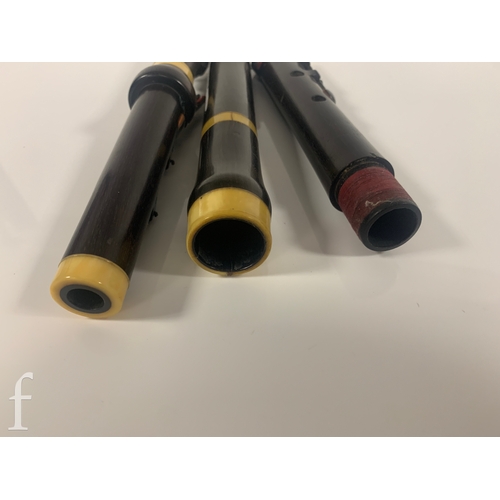 476 - A 19th Century Rudall Rose Carte & Co three sectional flute, in mahogany case.