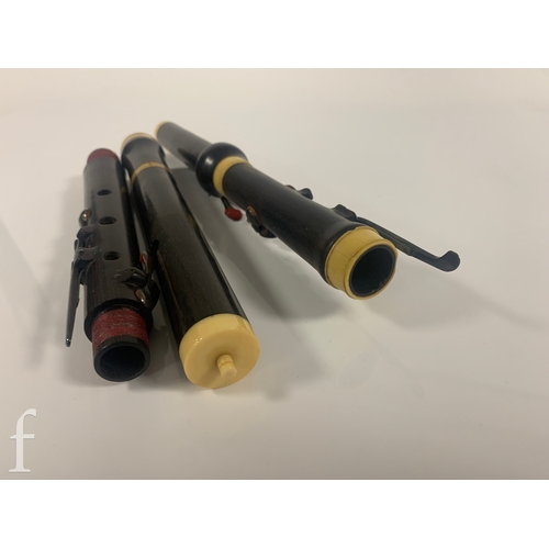 476 - A 19th Century Rudall Rose Carte & Co three sectional flute, in mahogany case.