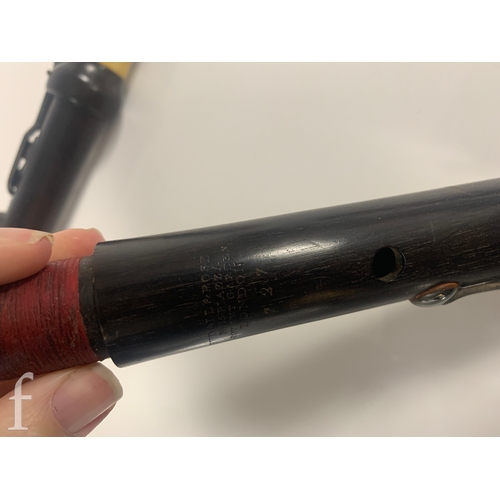 476 - A 19th Century Rudall Rose Carte & Co three sectional flute, in mahogany case.