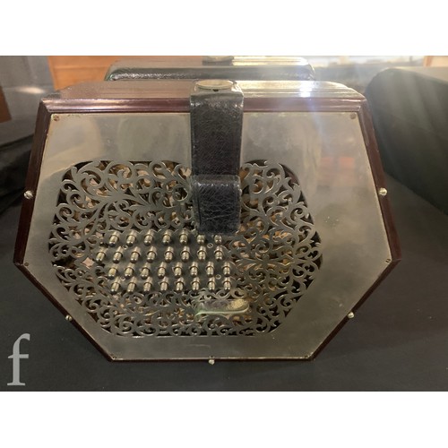 480 - A late 19th to early 20th Century octagonal cased concertina, thirty two button operation, in pine c... 