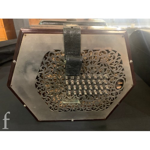 480 - A late 19th to early 20th Century octagonal cased concertina, thirty two button operation, in pine c... 