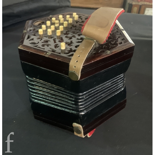 455 - A 19th Century concertina by Lachnal & Co London No 142550, thirty three keys, in octagonal maho... 