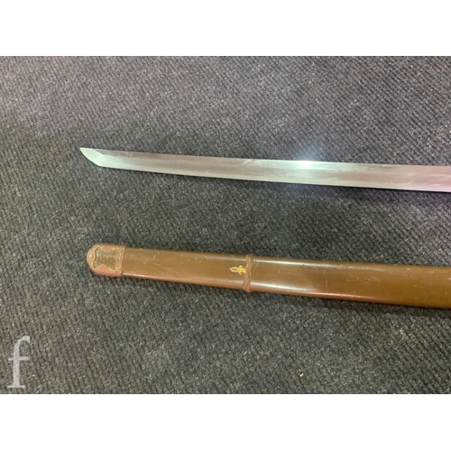 650 - A World War Two Japanese officers Katana, 70cm blade, cloth bound shagreen grip and pierced iron Tsu... 