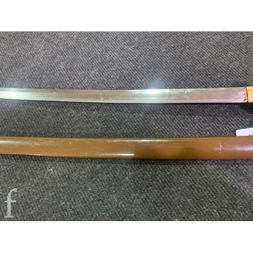 650 - A World War Two Japanese officers Katana, 70cm blade, cloth bound shagreen grip and pierced iron Tsu... 