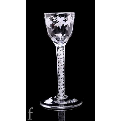An 18th Century drinking glass circa 1770, the ogee bowl enameled with a fruiting vine to the upper rim, attributed to Beilby, above an opaque twist stem with double multiply corkscrew raised to a shallow conical foot, height 15.5cm.