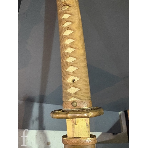 650 - A World War Two Japanese officers Katana, 70cm blade, cloth bound shagreen grip and pierced iron Tsu... 