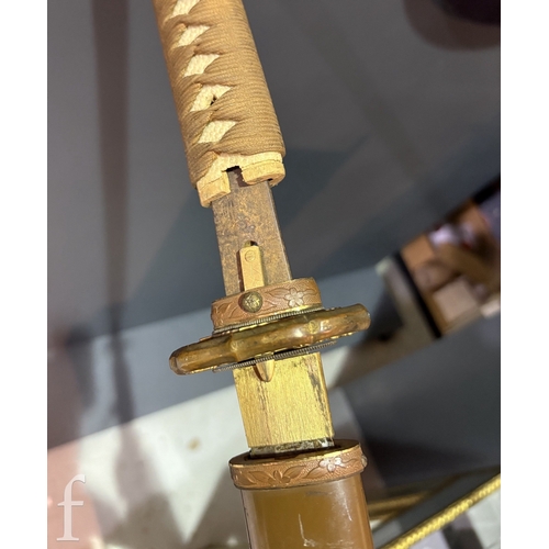 650 - A World War Two Japanese officers Katana, 70cm blade, cloth bound shagreen grip and pierced iron Tsu... 