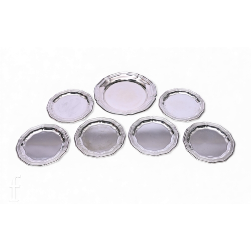 577 - A set of six&nbsp; 'Alpacca' wine glass coasters, of circular form with shaped reeded border, and a ... 