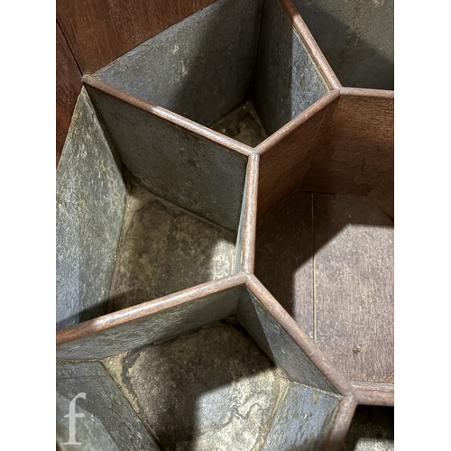 779 - A 19th Century mahogany octagonal cellarette fitted with a divisioned interior on moulded block legs... 