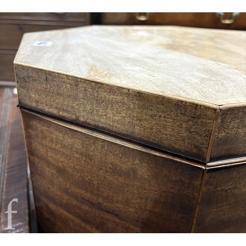 779 - A 19th Century mahogany octagonal cellarette fitted with a divisioned interior on moulded block legs... 