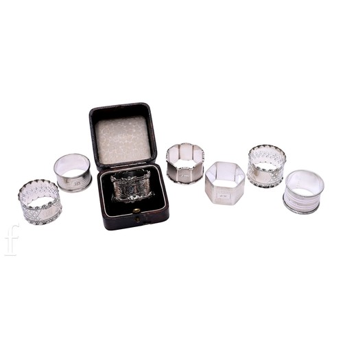 499 - A collection of hallmarked Edwardian and later silver napkin rings, some monogrammed, total weight 5... 