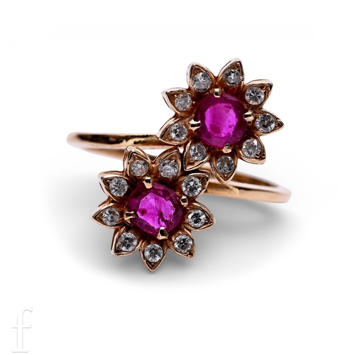 121 - A ruby and diamond ring, the double clusters set on a cross over mount, above a plain band, hallmark... 