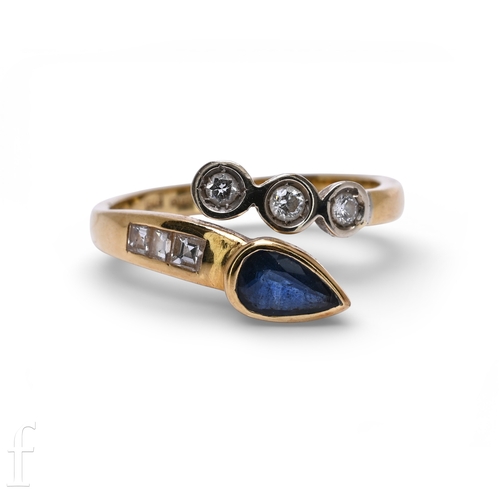 131 - A sapphire and diamond ring, the upper split band set with a pear-cut sapphire collet and three step... 