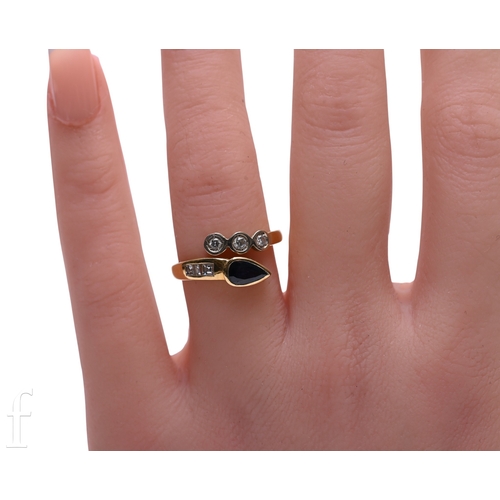 131 - A sapphire and diamond ring, the upper split band set with a pear-cut sapphire collet and three step... 