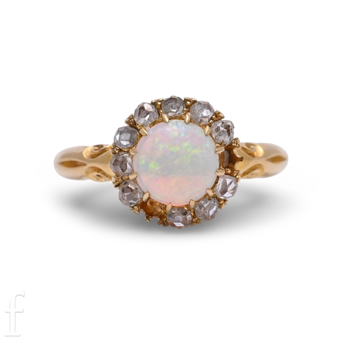 29 - An opal and diamond ring, the circular-cut opal cabochon, within a border of old brilliant-cut diamo... 