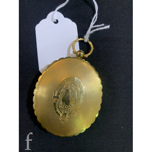 12 - A Victorian locket, circa 1860, the oval locket with two hinged covers, one glass locket insert lack... 