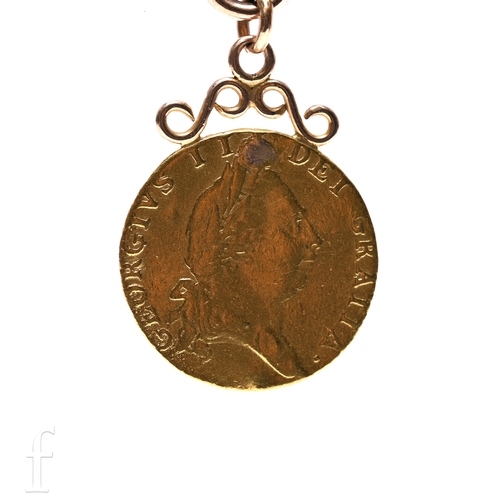 320 - An 18th Century George III half spade Guinea dated 1787, later converted to a fob with an open scrol... 