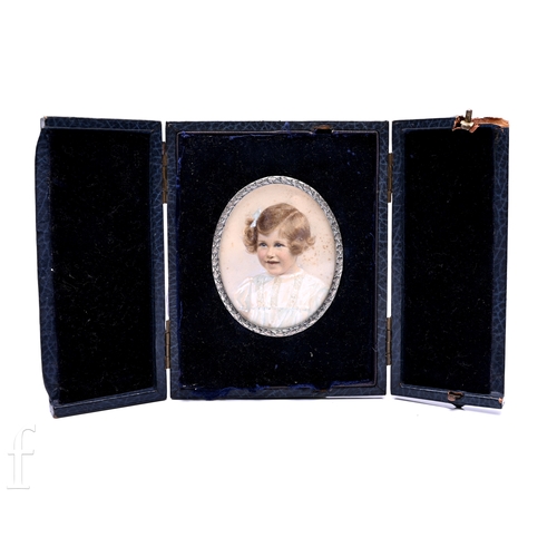 393 - A mid to late Victorian portrait miniature on paper, of oval form, young girl with ribbon in her hai... 