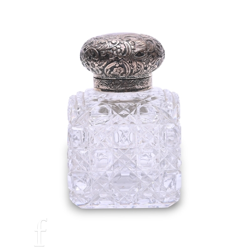 503 - A Victorian cut glass bottle, of square form, hobnail and star cut with foliate and floral embossed ... 