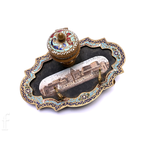 384 - A late 19th Century French gilt metal champleve enamelled inkwell, the ogee shaped border reserving ... 