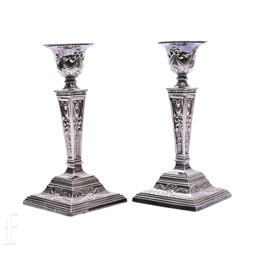 511 - A pair of Elizabeth II silver candlesticks, S J Rose & Son, Birmingham 1973, cast in the Adam st... 